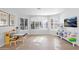 Versatile bonus room perfect for playroom or study, featuring large windows and bright lighting at 18014 N 53Rd Pl, Scottsdale, AZ 85254
