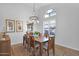 Formal dining area with a wooden table, seating for six, and decorative chandelier at 18014 N 53Rd Pl, Scottsdale, AZ 85254
