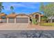 Charming single-Gathering home featuring a tile roof, desert landscaping, and a two-car garage at 18014 N 53Rd Pl, Scottsdale, AZ 85254