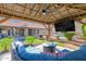 Gazebo with outdoor seating, fire pit, TV, ceiling fan, and backyard views and pool at 18014 N 53Rd Pl, Scottsdale, AZ 85254