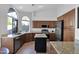 Bright kitchen featuring granite counters, stainless steel appliances and ample cabinet space at 18014 N 53Rd Pl, Scottsdale, AZ 85254