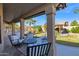 Covered patio with multiple seating options, view of the pool, and access to the backyard at 18014 N 53Rd Pl, Scottsdale, AZ 85254