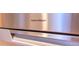 Close up of a stainless steel appliance with Fisher & Paykel logo at 19700 N 76Th St # 2001, Scottsdale, AZ 85255
