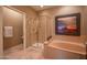 Bright bathroom featuring a standalone shower, a bathtub, and tiled floors at 19700 N 76Th St # 2001, Scottsdale, AZ 85255