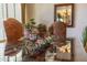 Close up of a dining table centerpiece with a candle and mirror reflecting the lighting at 19700 N 76Th St # 2001, Scottsdale, AZ 85255