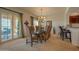 Bright dining area with a glass table, chandelier, and sliding doors to outdoor area at 19700 N 76Th St # 2001, Scottsdale, AZ 85255