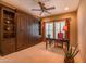 Elegant home office features custom built-ins, shuttered windows and designer touches at 19700 N 76Th St # 2001, Scottsdale, AZ 85255