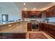 Updated kitchen featuring granite counters, stainless appliances, and ample cabinet space for storage at 19700 N 76Th St # 2001, Scottsdale, AZ 85255