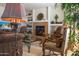 Inviting living room featuring a cozy fireplace, elegant decor, and comfortable seating arrangements at 19700 N 76Th St # 2001, Scottsdale, AZ 85255