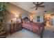 Tastefully decorated main bedroom with a ceiling fan and traditional furnishings at 19700 N 76Th St # 2001, Scottsdale, AZ 85255