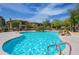 Large community pool showcases refreshing water, mature landscaping, and comfortable lounge areas at 19700 N 76Th St # 2001, Scottsdale, AZ 85255