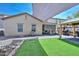 Extensive backyard with covered patio, gazebo, artificial turf, shade and stone retaining wall at 20338 N 262Nd Ave, Buckeye, AZ 85396