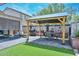 Landscaped backyard with gazebo, outdoor kitchen, artificial turf, BBQ and comfortable patio seating area at 20338 N 262Nd Ave, Buckeye, AZ 85396