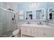 Modern bathroom features walk-in shower, double mirrors, and blue walls at 20338 N 262Nd Ave, Buckeye, AZ 85396
