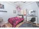 Charming bedroom with a pink accent blanket, a stuffed animal hammock, and stylish decor at 20338 N 262Nd Ave, Buckeye, AZ 85396