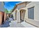Charming home exterior featuring a covered entrance, a beautifully paved walkway and a manicured landscape at 20338 N 262Nd Ave, Buckeye, AZ 85396