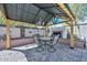 Charming gazebo featuring a fireplace, outdoor seating, decorative lighting, and a beautifully paved patio at 20338 N 262Nd Ave, Buckeye, AZ 85396