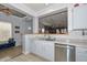 Contemporary kitchen with stainless steel appliances, granite countertops, and a pass-through to the living area at 20338 N 262Nd Ave, Buckeye, AZ 85396