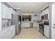 Modern kitchen with stainless steel appliances, granite countertops, stylish backsplash, and ample cabinet space at 20338 N 262Nd Ave, Buckeye, AZ 85396