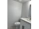 Modern bathroom featuring a white vanity with a white countertop and a toilet at 225 N Pomeroy -- # 16, Mesa, AZ 85201