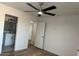 A clean bedroom view of the sink and door, accentuated by the ceiling fan at 225 N Pomeroy -- # 16, Mesa, AZ 85201