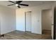 Bedroom view of a door and ceiling fan at 225 N Pomeroy -- # 16, Mesa, AZ 85201