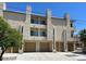 View of condo building with attached garages, stucco facade, and low maintenance landscaping at 225 N Pomeroy -- # 16, Mesa, AZ 85201