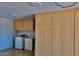 Garage featuring cabinets, washer, and dryer at 225 N Pomeroy -- # 16, Mesa, AZ 85201