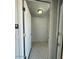 Bright hallway featuring tile floors, white doors, and modern lighting at 225 N Pomeroy -- # 16, Mesa, AZ 85201