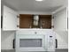 Updated kitchen featuring white cabinets, modern appliances, stainless steel sink, and tile flooring at 225 N Pomeroy -- # 16, Mesa, AZ 85201