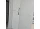 Clean white pantry with black hardware, offering storage and organization in a modern style at 225 N Pomeroy -- # 16, Mesa, AZ 85201