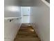 A staircase leads to a door with new floor at 225 N Pomeroy -- # 16, Mesa, AZ 85201