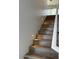 Staircase with wooden steps and illuminated with embedded lights at 225 N Pomeroy -- # 16, Mesa, AZ 85201