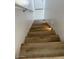 Carpeted stairway with a white railing on one side and recessed lighting at 225 N Pomeroy -- # 16, Mesa, AZ 85201