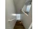 Stairway featuring wood steps, white walls, and a white handrail, with an overhead ceiling fan at 225 N Pomeroy -- # 16, Mesa, AZ 85201