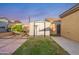 Well-maintained backyard with storage shed, grassy area, and easy-to-care-for landscape design at 23932 W Hidalgo Ave, Buckeye, AZ 85326