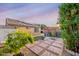 Lovely backyard featuring a playset, patio, and lush garden, ideal for relaxation at 23932 W Hidalgo Ave, Buckeye, AZ 85326