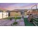 Spacious backyard featuring a playset and well manicured grass, perfect for outdoor activities at 23932 W Hidalgo Ave, Buckeye, AZ 85326