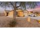Charming single-story home with a two-car garage and easy to care for desert landscaping at 23932 W Hidalgo Ave, Buckeye, AZ 85326