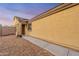 Side view of a cozy single-story home with a walkway and low-maintenance landscaping at 23932 W Hidalgo Ave, Buckeye, AZ 85326