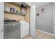 Efficient laundry area equipped with modern washer and dryer units at 23932 W Hidalgo Ave, Buckeye, AZ 85326