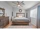 Bedroom with ceiling fan, a neutral color scheme and coordinated furnishings at 23932 W Hidalgo Ave, Buckeye, AZ 85326