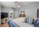 Comfortable bedroom with an ensuite bathroom and warm wooden furniture at 23932 W Hidalgo Ave, Buckeye, AZ 85326