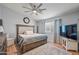 Bedroom featuring a ceiling fan, window, stylish furnishings, and wood-look flooring at 23932 W Hidalgo Ave, Buckeye, AZ 85326