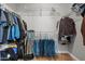 Organized walk-in closet with shelving, hanging rods, and storage for clothes and accessories at 23932 W Hidalgo Ave, Buckeye, AZ 85326
