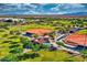 Overhead view of well-maintained baseball fields surrounded by trees, pathways, and mountain views at 24066 N 167Th Ln, Surprise, AZ 85387