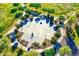 Great aerial view of a basketball court with green trees, landscaping and walkways at 24066 N 167Th Ln, Surprise, AZ 85387