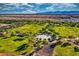 Expansive green space featuring a playground and picnic area, surrounded by walking paths and trees at 24066 N 167Th Ln, Surprise, AZ 85387
