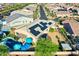 Backyard oasis with a sparkling pool, lush landscaping, and solar panels for energy efficiency at 24066 N 167Th Ln, Surprise, AZ 85387
