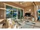 Inviting covered back patio with ceiling fan, lounge furniture, TV, and view to the pool at 24066 N 167Th Ln, Surprise, AZ 85387